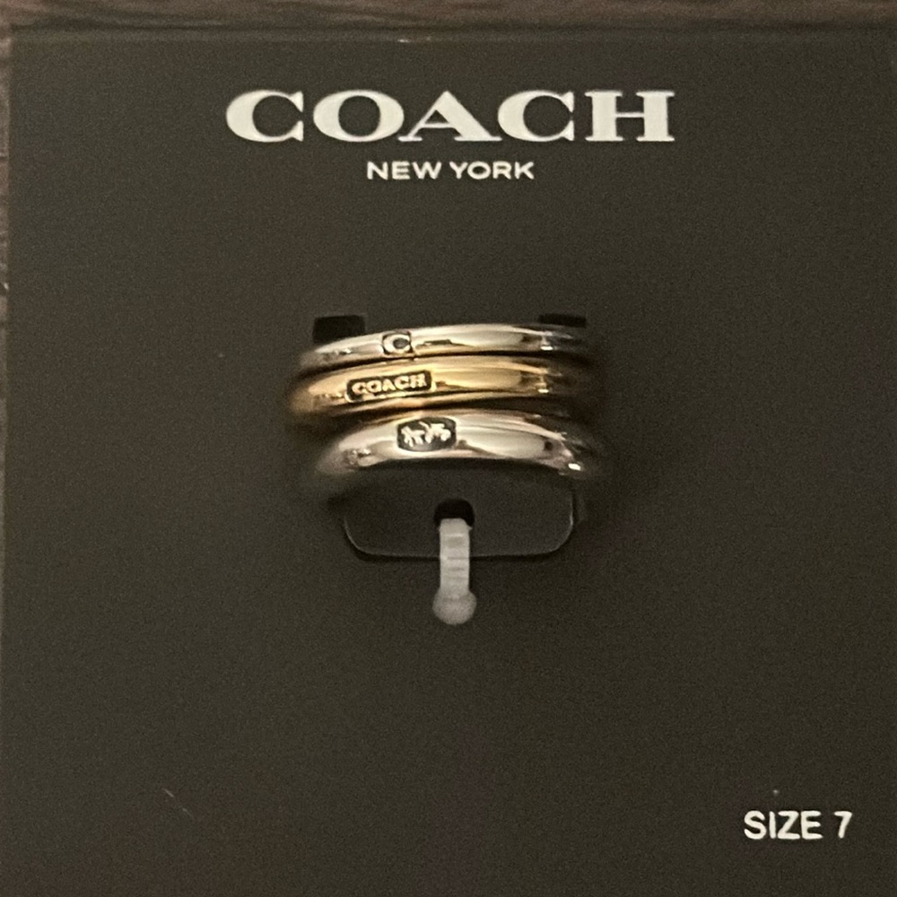 Coach gold and silver 3 piece ring set.